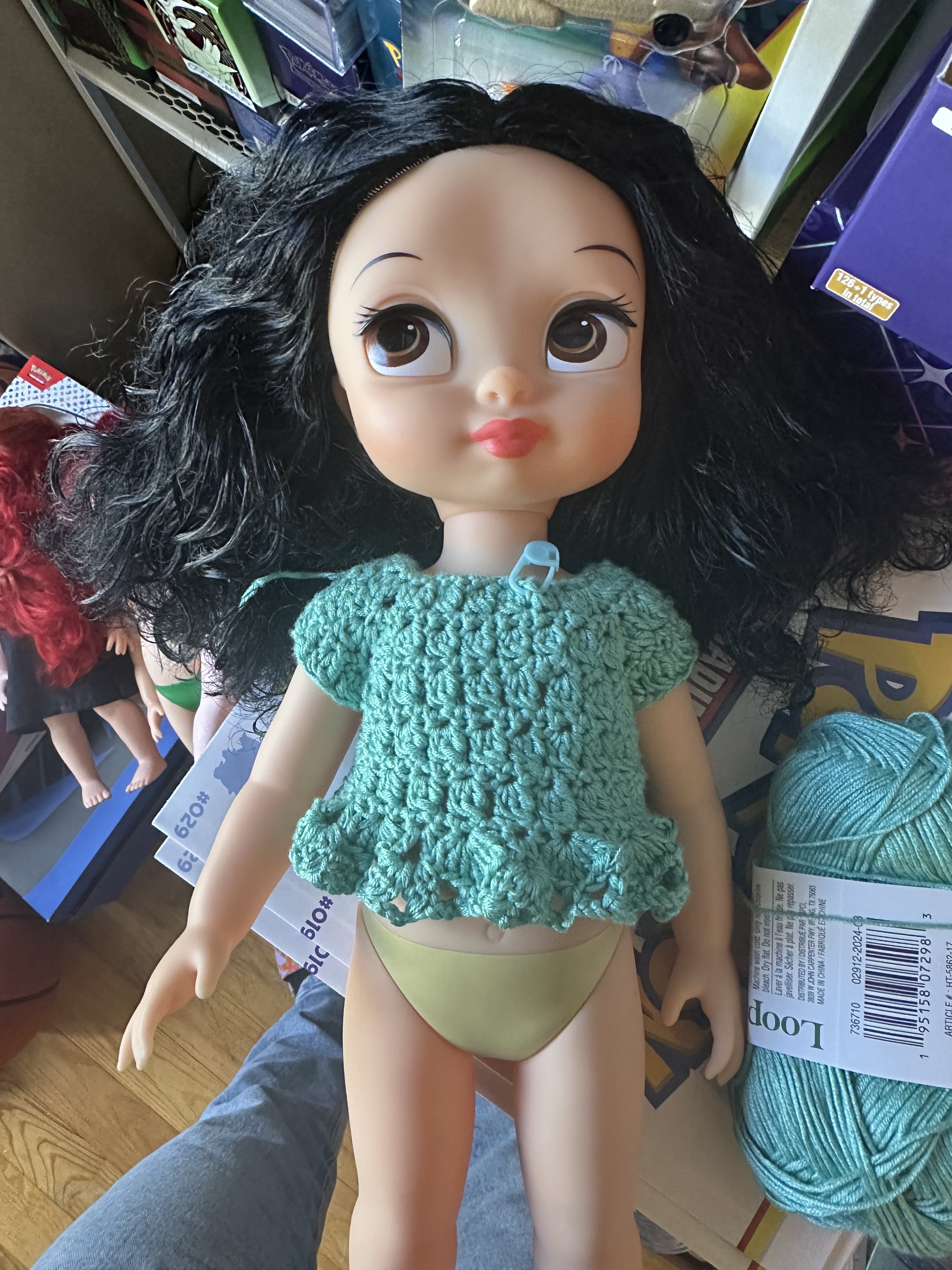 Image of a Disney Animator's Snow White doll wearing a teal crochet top